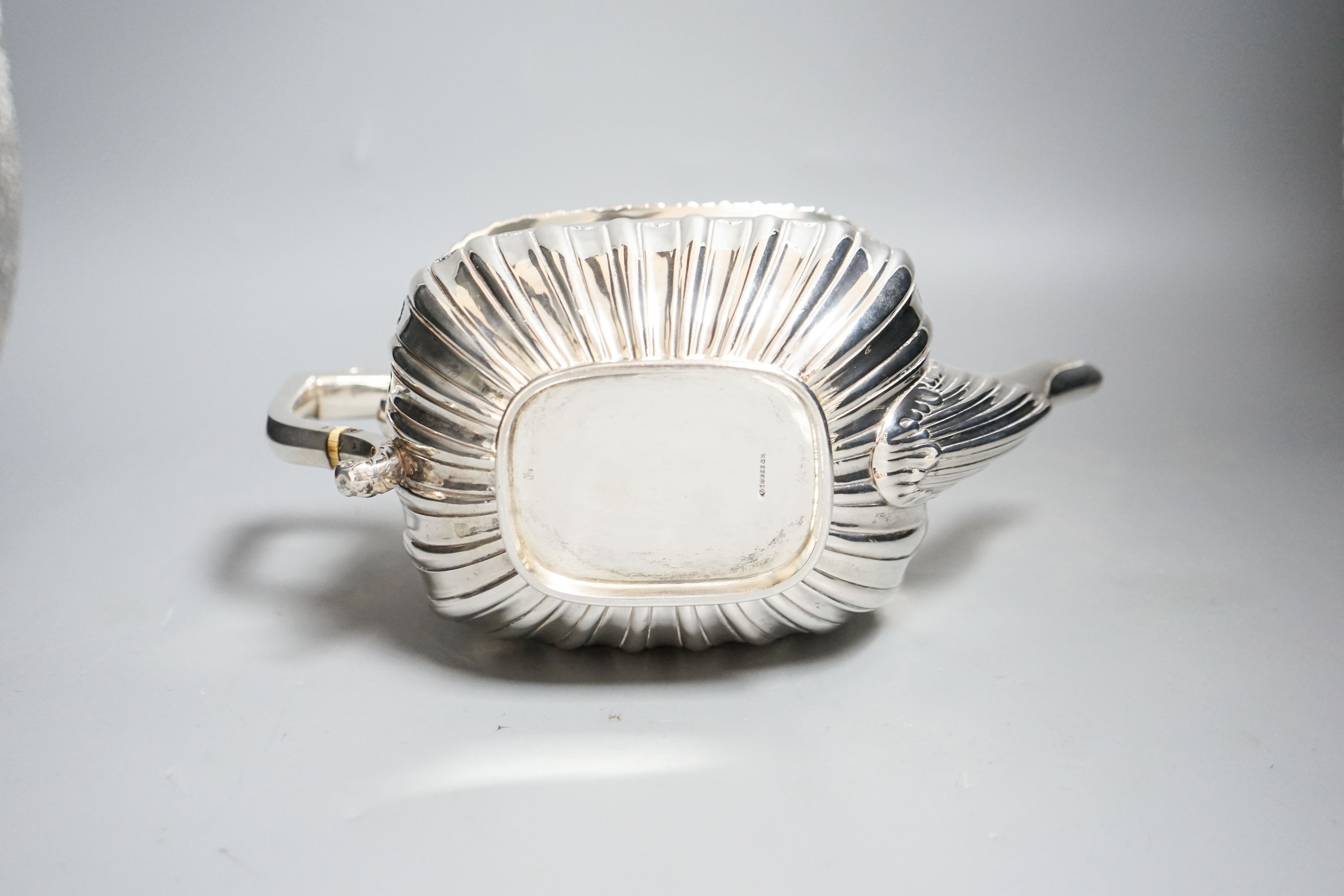 An Edwardian demi-fluted silver teapot, Sheffield, 1901, gross 22.5oz.